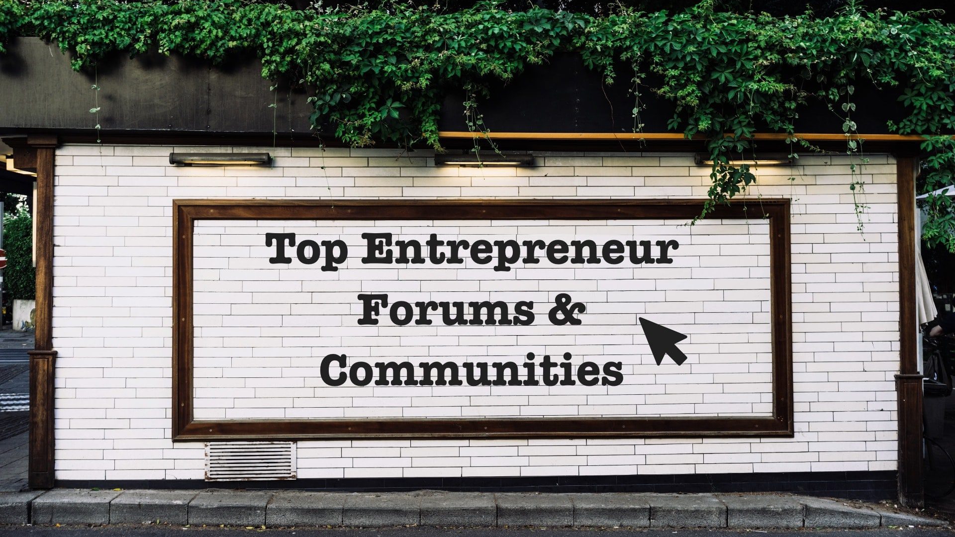 Top online entrepreneur forums - image of small business owners looking at a motivational sign that says 